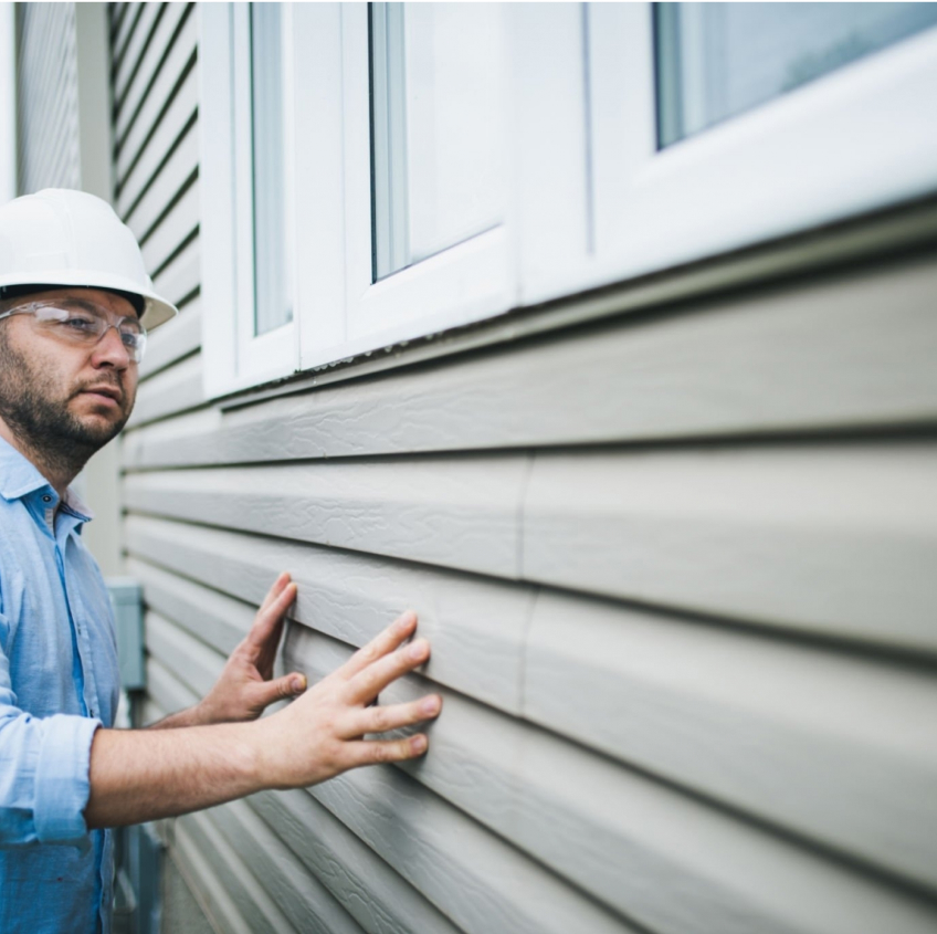 Abpom Inspector checking out the cladding